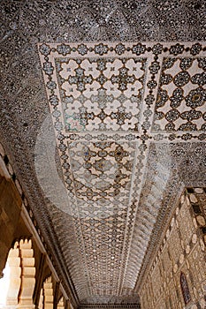 Low-angle shot of the ceiling of Sheesh Mahal with Asian-style patterns and vibrant colors