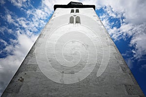 Low-angle shot of the church of Holy Spirit with a cloudy blue sky in the background Zegre, Slovakia