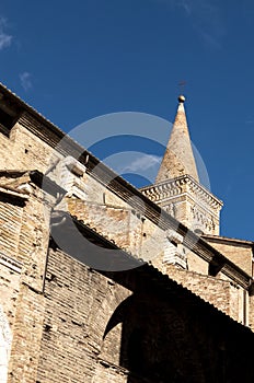 Low angle shot of a church tower Asissi, Italy photo