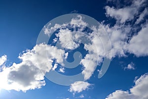 Low angle shot of a cloudy blue sky at daytime in summer - perfect for wallpapers and backgrounds