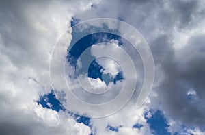 Low angle shot of a cloudy blue sky at daytime in summer - perfect for wallpapers and backgrounds