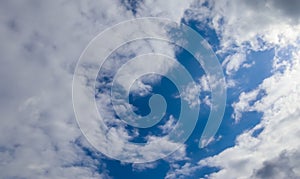 Low angle shot of a cloudy blue sky at daytime in summer - perfect for wallpapers and backgrounds