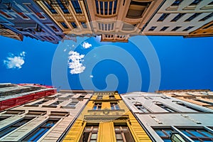 Low angle shot of colorful old tenement buildings in Torun, Poland