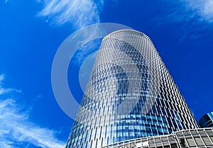 Low angle shot displaying a modern, business skyscrapers between clouds - Addax tower, Reem Island, Abu Dhabi, UAE