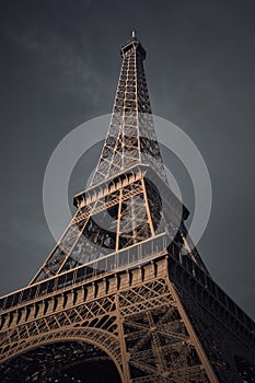 Low angle shot of the Eiffel tower in Prais, France during the gloomy weather photo