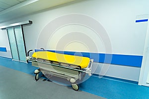 Low angle shot of the emergency bed or gurney for wheeling a patient along the hospital corridor. Closeup.