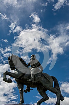Low-angle shot of the Equestrian Statue of Simon Bolivar against a blue cloudy sky