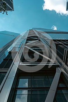 Low angle shot of the facade of a modern offices building under blue sky