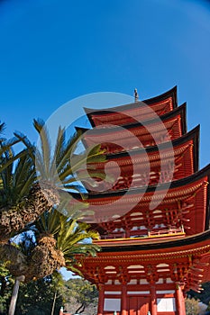 Low-angle shot of the five-storied pagoda on Miyajima Island. Hatsukaichi, Japan.