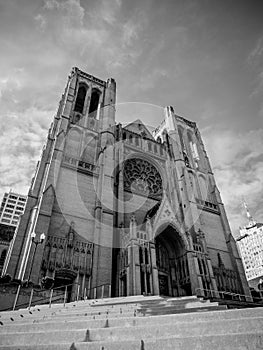Low angle shot of Grace Cathedral on Nob Hill, San Francisco, USA, in grayscale photo