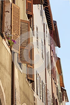 Low angle shot of historic buildings with mallorquina shutters in Annecy, France photo