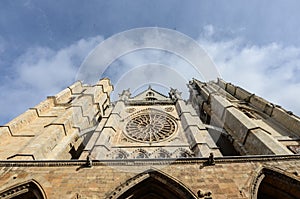 Low angle shot of the historic Catedral de Leon in Spain under the cloudy sky photo