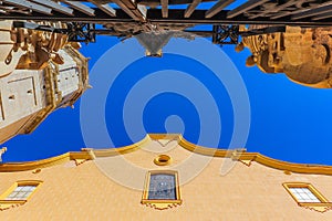 Low angle shot of a historical building in Villareal, Valencia, Spain with the view of the blue sky photo