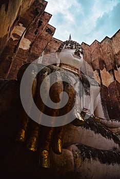 Low-angle shot of the huge statue of Buddha in Wat Si Chum Thailand