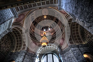 Low-angle shot of the interior of the Washington State Capitol with ornamented walls and dome