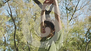 Low angle shot of a lovely young woman doing yoga at park