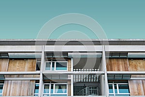 Low angle shot of a modern wooden building under the blue sky