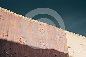 Low angle shot of an old building decorated with symbols in the Habous district, Casablanca, Morocco photo