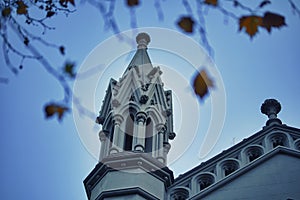 Low angle shot of old ornamental Cathedral tower under blue sky