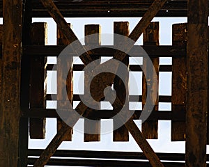 Low angle shot of Old wooden railway bridge texture in Kuala Kangsar, Perak, Malaysia