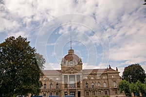 Low angle shot of the Palace of Rhin in Strasbourg, France under the cloudy sky