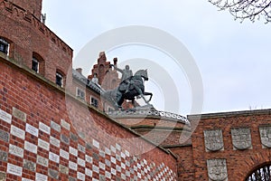 Low angle shot of a sculpture on the roof of the famous Wawel Royal Castle Krakow, Poland