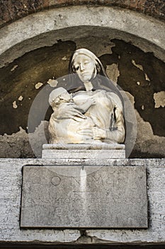 Low angle shot of the statue of a mother with a baby in Venice, Italy