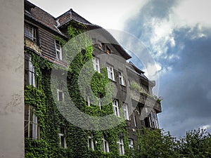 Low angle shot of tenant building in downtown Katowice, Upper Silesia, Poland under cloudy sky