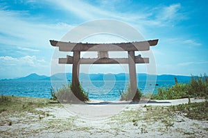 Low angle shot of a torii at a beach in Naoshima Island, Japan during summer