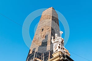 Low angle shot of the tower of Torre Garisenda in Bologna photo