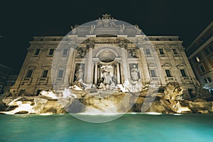 Low angle shot of the Trevi Fountain in Rome, Italy during nighttime