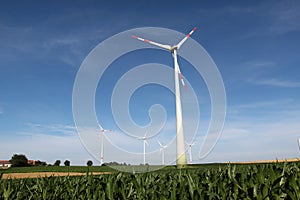 Low angle shot of wind turbines in a field