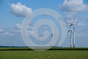 Low angle shot of Wind turbines in Germany under a cloudy sky