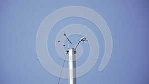 Low angle shot of wind vane and speed meter on the mast of the yacht