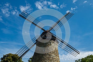 Low angle shot of Windmill of the Cotentin against a blue sky