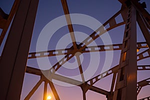 Low angle of steel bridge structure on twilight sky background