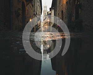 Low angle urban reflection early in the morning. Ancient medieval town in Italy