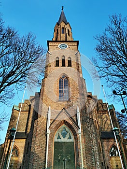 Low angle vertical shot of the Tonsberg Cathedral in Norway captured on a sunny day