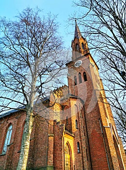 Low angle vertical shot of the Tonsberg Cathedral in Norway captured on a sunny day