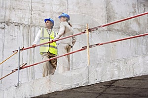 Low angle view of an architect and construction manager on site