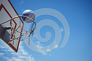 Low angle view of blue basketball in hoop