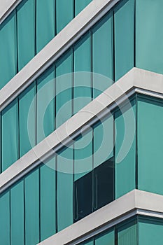 Low angle view of blue roller blinds inside of modern glass office building