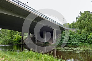 Low angle view of bridge over river against sky