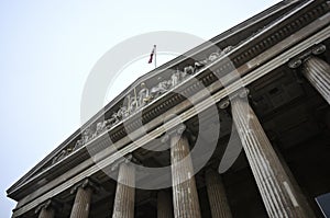 Low angle view of The British Museum under a cloudy sky in London in England