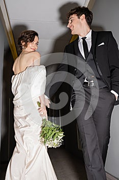 low angle view of cheerful groom