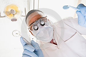 Low angle view of dentist and dental nurse