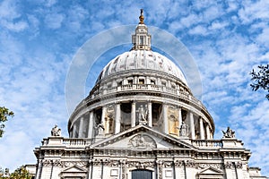 Low angle view of the Dome of St Paul Cathedral in London against blue sky