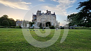 Low-angle view of Dumbleton Hall in the forest in the UK