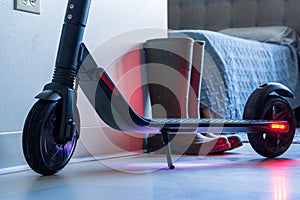 Low angle view of an e-scooter. Wheels and deck