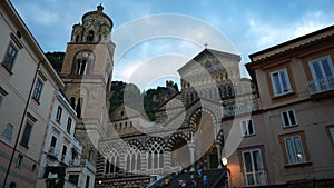 Low-angle view facade of Amalfi Cathedral bell tower in Amalfi. Church of Apostle Saint Andrew, Roman Catholic church in